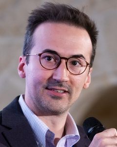 Adam W. Hansen speaking on a panel
